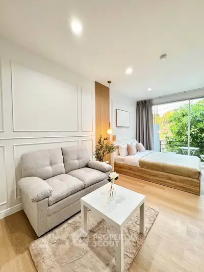 Modern studio apartment with cozy living area and stylish decor