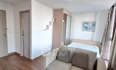 Modern studio apartment with cozy bed and stylish decor