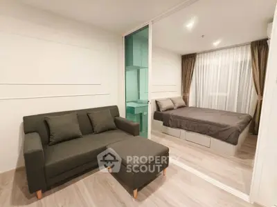 Modern studio apartment with cozy living area and stylish bedroom