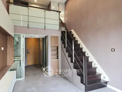 Modern duplex interior with sleek staircase and open layout, perfect for stylish urban living.