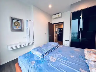 Modern bedroom with city view and stylish decor