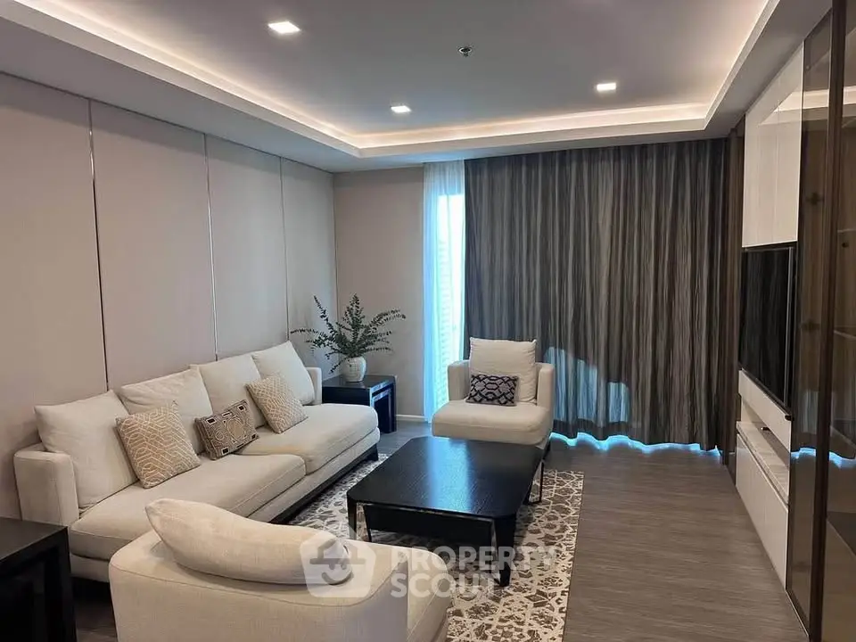 Elegant modern living room with cozy seating and stylish decor