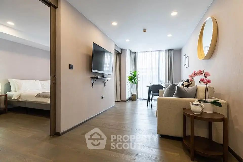 Modern open-plan living room with stylish decor and natural light