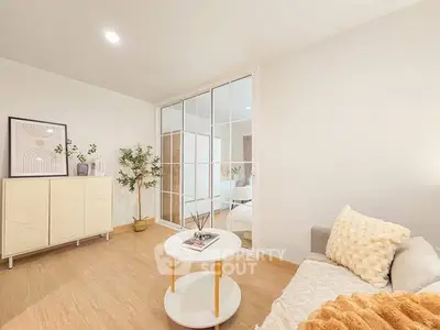Bright and cozy living room with modern decor and mirrored closet doors.