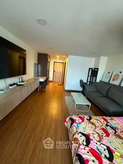 Spacious modern living room with wooden flooring and stylish decor
