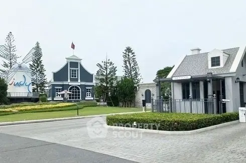 Charming residential community with elegant homes and manicured lawns, showcasing a serene lifestyle with picturesque surroundings.