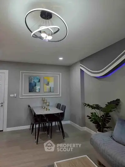 Modern living room with stylish decor and elegant lighting