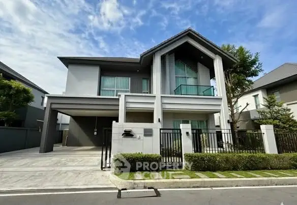Modern two-story house with sleek design and spacious driveway