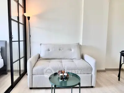 Modern living room with cozy sofa and stylish decor in bright apartment
