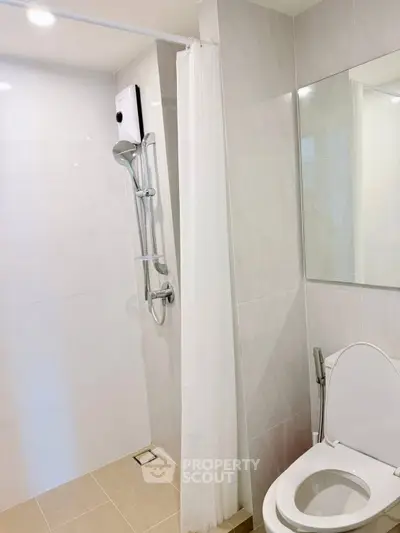 Modern bathroom with shower and toilet in sleek design