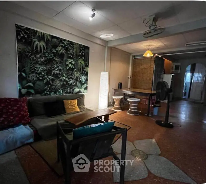 Cozy living room with unique decor and ambient lighting, perfect for relaxation and entertaining guests.