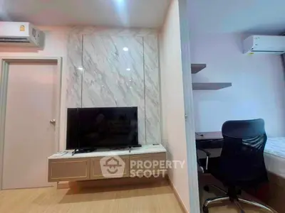 Modern living room with marble accent wall and sleek TV setup
