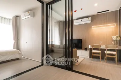 Modern apartment interior with glass partitions and stylish furnishings