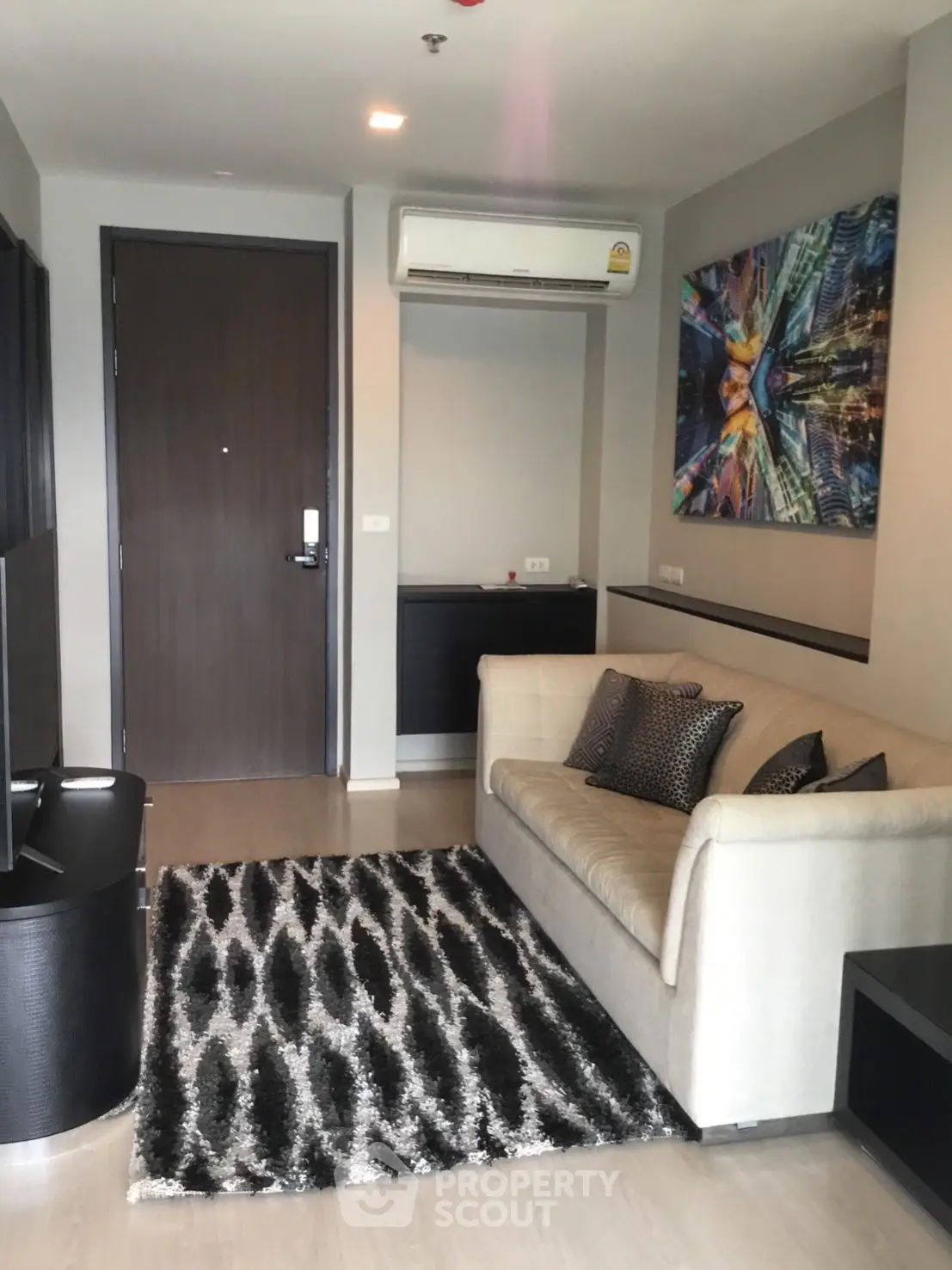 Modern living room with stylish decor and comfortable seating in a contemporary apartment.