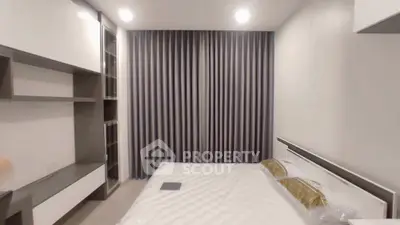 Modern bedroom with sleek design and ample storage space