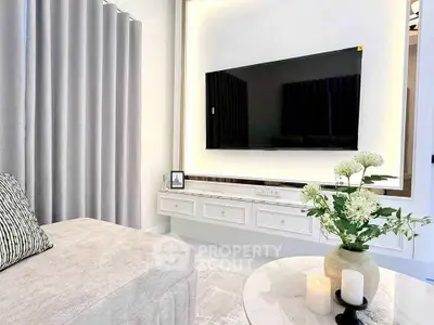 Modern living room with sleek TV setup and elegant decor