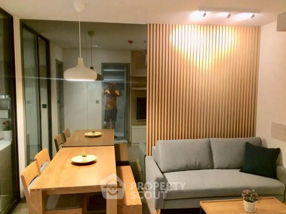 Modern living room with wooden accents and cozy seating area