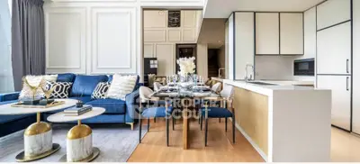 Luxurious open-plan living room and kitchen with elegant decor and modern furnishings.