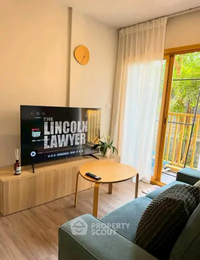 Cozy living room with modern decor and balcony view