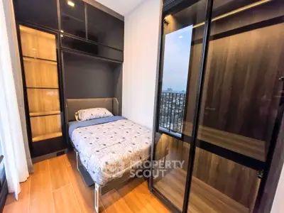 Modern bedroom with city view and sleek wardrobe design