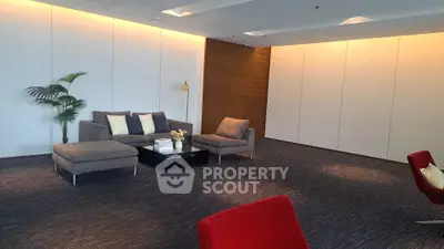 Modern living room with stylish furniture and ambient lighting, perfect for relaxation and entertaining.