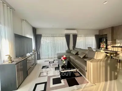 Luxurious modern living room with elegant decor and ample natural light