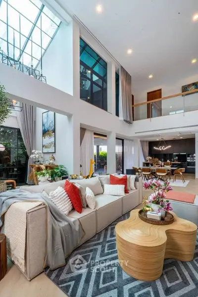 Spacious modern living room with high ceilings and stylish decor