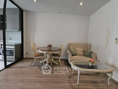 Charming living room with elegant furniture and open kitchen view
