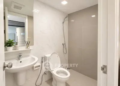 Modern bathroom with sleek fixtures and elegant tile design