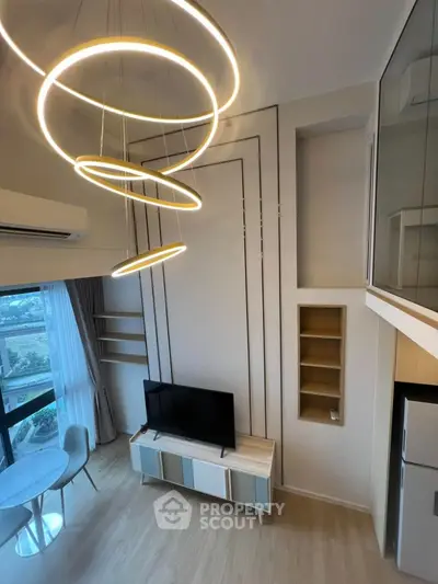 Modern living room with stylish lighting and large window view