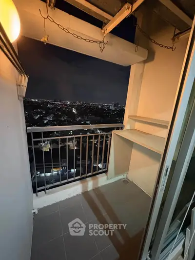 Cozy balcony with stunning city night view, perfect for relaxation and enjoying the skyline.