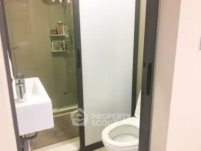 Modern compact bathroom with shower and sleek design