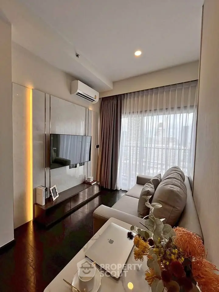 Modern living room with sleek decor and large window view