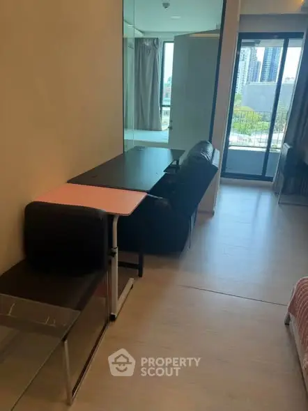 Modern apartment interior with sleek furniture and balcony view