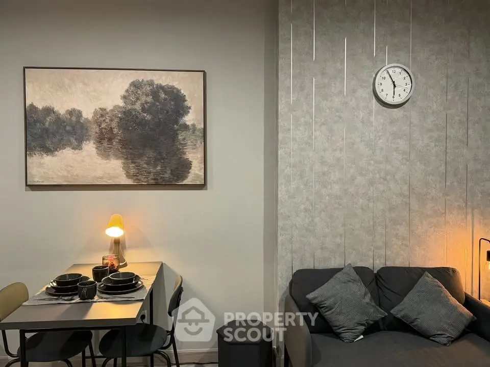 Stylish living room with modern decor, cozy sofa, and elegant dining area, perfect for urban living.