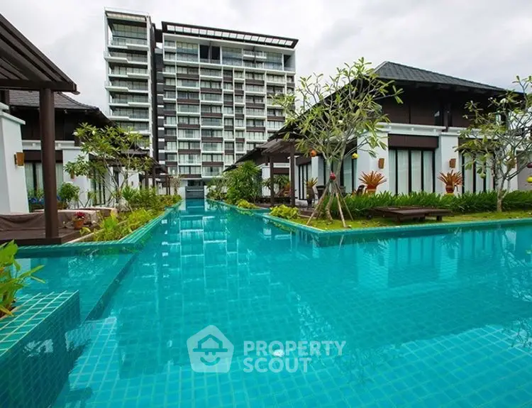 Luxurious residential complex with stunning pool and modern architecture.