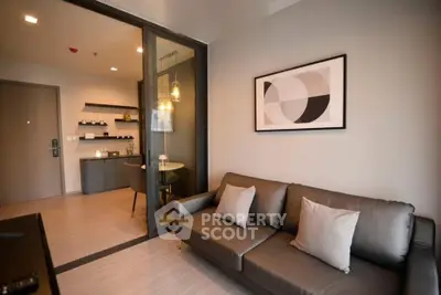 Modern living room with stylish decor and cozy seating in a contemporary apartment.