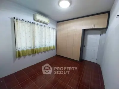 Spacious bedroom with built-in wardrobe and air conditioning