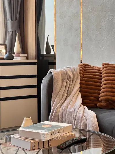 Stylish living room with cozy sofa, elegant decor, and modern design elements.