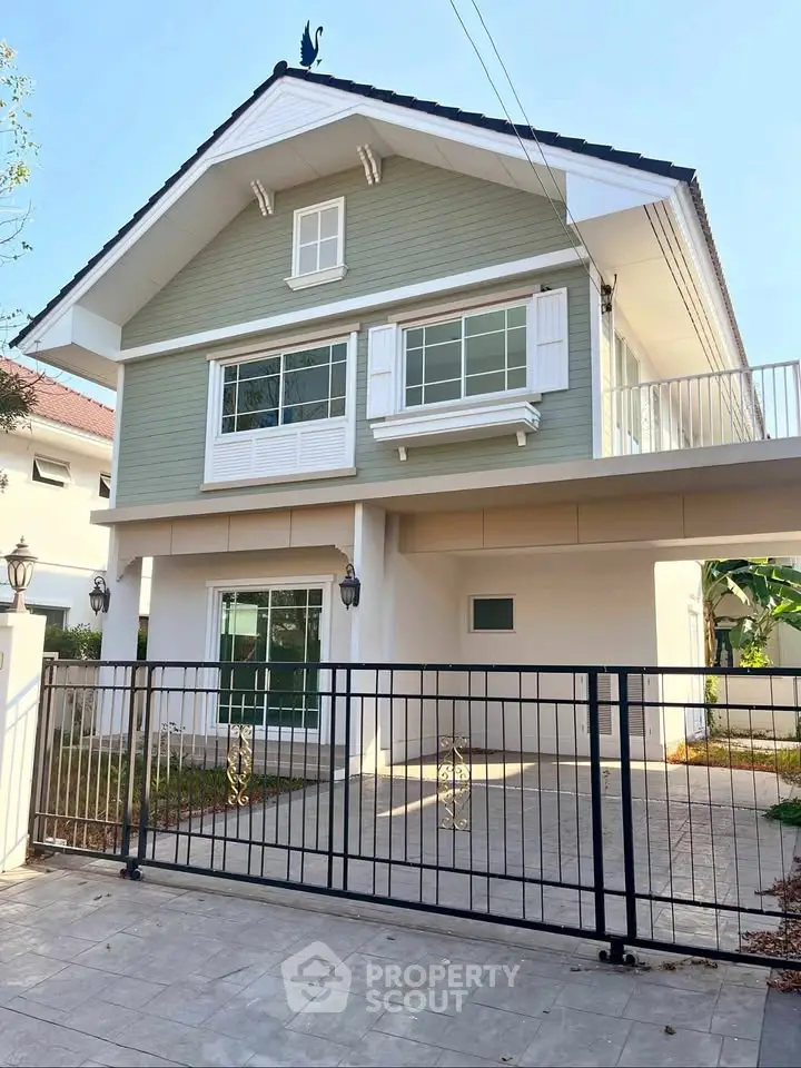 Charming two-story house with modern design and spacious driveway in a serene neighborhood.