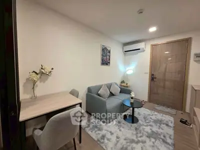 Cozy modern living room with stylish furniture and air conditioning