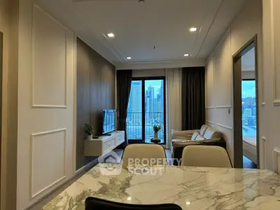 Modern living room with city view and elegant marble dining table.