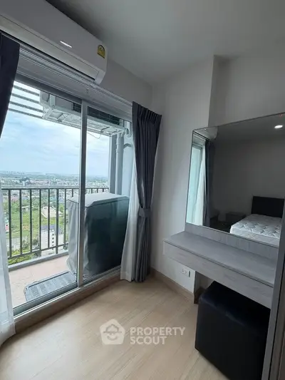 Modern bedroom with balcony view in high-rise apartment