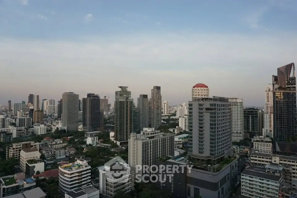 Stunning cityscape view showcasing modern high-rise buildings and urban skyline at dusk.