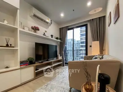 Modern living room with balcony view, stylish decor, and cozy seating in a contemporary apartment.
