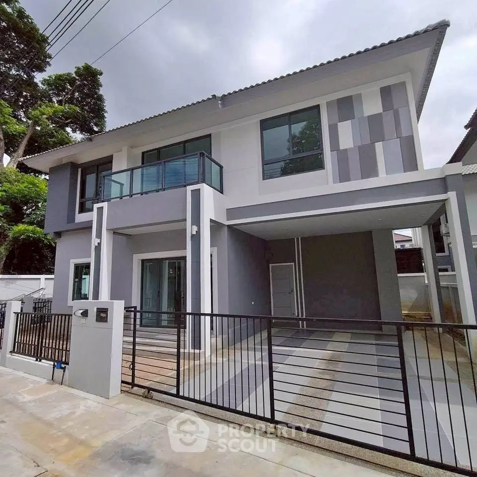 Modern two-story house with sleek design and spacious driveway