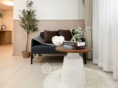Stylish living room with modern decor and cozy seating area, perfect for relaxation.