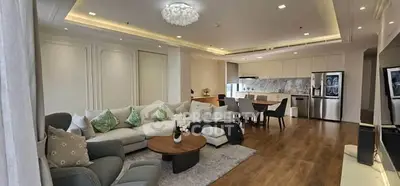 Spacious open-plan living room with modern kitchen and elegant decor