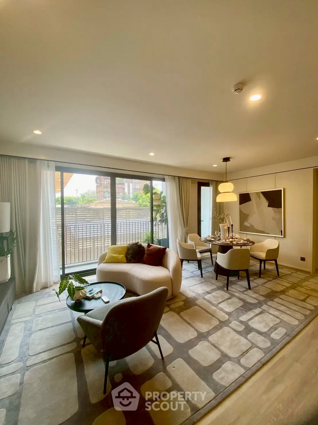 Luxurious living room with modern decor and large windows offering a stunning view.