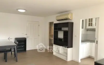 Spacious living room with modern furniture and open kitchen layout